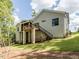 House exterior showcasing a large deck and landscaping at 64 W Beech Slope Ct, Chapel Hill, NC 27517