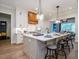 Modern kitchen with white cabinets, large island, and stainless steel appliances at 64 W Beech Slope Ct, Chapel Hill, NC 27517