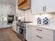 Modern kitchen with stainless steel appliances and white cabinets at 64 W Beech Slope Ct, Chapel Hill, NC 27517