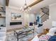 Living area with a fireplace, built-in shelving, and hardwood floors at 64 W Beech Slope Ct, Chapel Hill, NC 27517