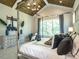Main bedroom with high ceilings and a canopy bed at 64 W Beech Slope Ct, Chapel Hill, NC 27517