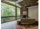 Relaxing screened porch with fireplace and wooded views at 64 W Beech Slope Ct, Chapel Hill, NC 27517