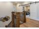 Upstairs hall with hardwood floors and barn doors at 64 W Beech Slope Ct, Chapel Hill, NC 27517