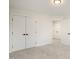 Bright bedroom with double doors and carpet flooring at 649 Mcadams Rd, Hillsborough, NC 27278
