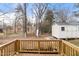 Wooden deck overlooking backyard with trees and shed at 649 Mcadams Rd, Hillsborough, NC 27278