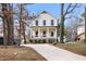 Two-story craftsman home with white siding, black windows, and a front porch at 649 Mcadams Rd, Hillsborough, NC 27278