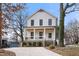 Two-story craftsman home with white siding, black windows, and a front porch at 649 Mcadams Rd, Hillsborough, NC 27278