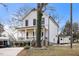 Two-story craftsman home with white siding, black windows, and a front porch at 649 Mcadams Rd, Hillsborough, NC 27278