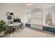 Bright home office with built-in Murphy bed, window seating, and modern minimalist design at 649 Mcadams Rd, Hillsborough, NC 27278
