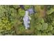 Aerial view of house surrounded by lush greenery at 715 Powell Dr, Raleigh, NC 27606
