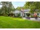 House backyard with large green lawn at 715 Powell Dr, Raleigh, NC 27606