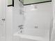 Clean bathroom with white tile and a shower/tub combo at 715 Powell Dr, Raleigh, NC 27606