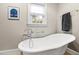 Charming bathroom with freestanding tub and updated fixtures at 715 Powell Dr, Raleigh, NC 27606