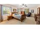 Bedroom with wooden sleigh bed, dresser, and massage chair at 715 Powell Dr, Raleigh, NC 27606
