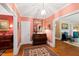 Bright entryway with hardwood floors and view to living room at 715 Powell Dr, Raleigh, NC 27606