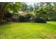 Brick house surrounded by lush green landscaping at 715 Powell Dr, Raleigh, NC 27606
