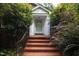 Front entrance with brick steps and a white door at 715 Powell Dr, Raleigh, NC 27606