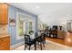 Eat-in kitchen with view into sunroom and backyard at 715 Powell Dr, Raleigh, NC 27606