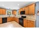 Modern kitchen offers granite countertops, wood cabinets, and a breakfast nook at 715 Powell Dr, Raleigh, NC 27606