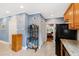 Bright kitchen has granite counters, wood cabinets, and access to dining area at 715 Powell Dr, Raleigh, NC 27606