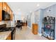 Kitchen features gas range, microwave, and view into adjacent living space at 715 Powell Dr, Raleigh, NC 27606