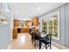 Bright kitchen with granite countertops, ample cabinetry, and breakfast nook at 715 Powell Dr, Raleigh, NC 27606