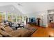Sunroom with vaulted ceiling, hardwood floors, and ample natural light at 715 Powell Dr, Raleigh, NC 27606