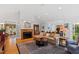 Spacious living room with fireplace and access to adjacent rooms at 715 Powell Dr, Raleigh, NC 27606