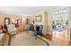 Spacious living room features hardwood floors, a fireplace, and views into the sunroom at 715 Powell Dr, Raleigh, NC 27606