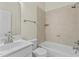 Bright bathroom featuring tub/shower combo, vanity with white sink, and tiled floors at 8005 Sundance Cir, Durham, NC 27713