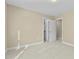 Bright bedroom with a door leading to the hallway and plush carpet at 8005 Sundance Cir, Durham, NC 27713