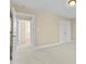 Neutral bedroom featuring carpet, large closet, and an open doorway to a connecting room at 8005 Sundance Cir, Durham, NC 27713