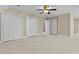Large bedroom featuring multiple closets and doorway to en-suite bathroom at 8005 Sundance Cir, Durham, NC 27713