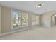 Spacious bedroom with two large windows at 8005 Sundance Cir, Durham, NC 27713