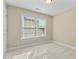 Bright and airy bedroom features carpet flooring, neutral paint, and window to allow in light at 8005 Sundance Cir, Durham, NC 27713