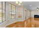 Sun-drenched dining area featuring hardwood floors, and multiple windows allowing for tons of natural light, and neutral paint at 8005 Sundance Cir, Durham, NC 27713