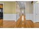 Spacious entryway boasting hardwood floors, neutral wall, and decorative trim, offering a view into the home at 8005 Sundance Cir, Durham, NC 27713