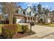 Charming two-story home with brick and siding, attached garage and a well manicured lawn at 8005 Sundance Cir, Durham, NC 27713