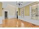 Elegant living room with hardwood floors, natural light, and access to other rooms at 8005 Sundance Cir, Durham, NC 27713