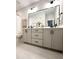 Double vanity bathroom with modern fixtures and large mirror at 962 Double Helix Rd, Apex, NC 27523