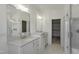 Elegant bathroom with double vanity, walk-in shower, and marble floors at 962 Double Helix Rd, Apex, NC 27523