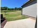 A backyard featuring a patio, some grass, and a wooded area at 1031 Coldspring Circle, Durham, NC 27705
