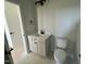 Bathroom featuring a toilet and a sink with white countertops and black fixtures at 1031 Coldspring Circle, Durham, NC 27705