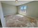 Bedroom features large window to neighborhood at 1031 Coldspring Circle, Durham, NC 27705