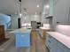 Bright kitchen with white cabinets, modern appliances, and large island at 1031 Coldspring Circle, Durham, NC 27705