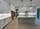 Modern kitchen with white cabinetry, an island, and stainless steel appliances at 1031 Coldspring Circle, Durham, NC 27705