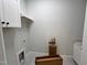 Laundry room featuring overhead cabinets and ample counter space at 1031 Coldspring Circle, Durham, NC 27705