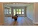 Bright living room with large windows offering natural light and views of the outdoors at 1031 Coldspring Circle, Durham, NC 27705