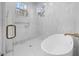Bathroom features a freestanding tub and walk-in shower at 113 Laurston Ct, Durham, NC 27712