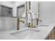 Double vanity with gold fixtures and quartz countertop at 113 Laurston Ct, Durham, NC 27712